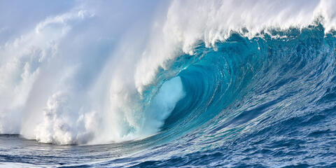 a stunning panoramic photograph of the biggest wave in Hawaii called Jaws (Peahi) from the water by Hawaii Wave Photographer Andrew Shoemaker. 
