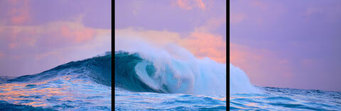 panorama sunset at Jaws (Peahi) on Maui with nice pastel tones as the biggest wave in Hawaii crashes.  Hawaii wave photography from Andrew Shoemaker