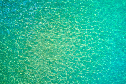 An aerial scene of amazing emerald Maui water color from the sky.  This unique abstract was captured by Andrew Shoemaker