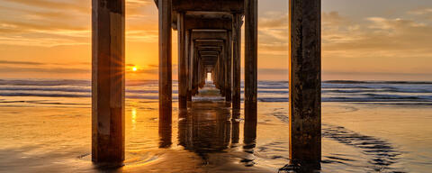 a calassic California sunset photograph at the beautiful Scripps Pier in La Jolla, California photographed by fine art photographer Andrew Shoemaker