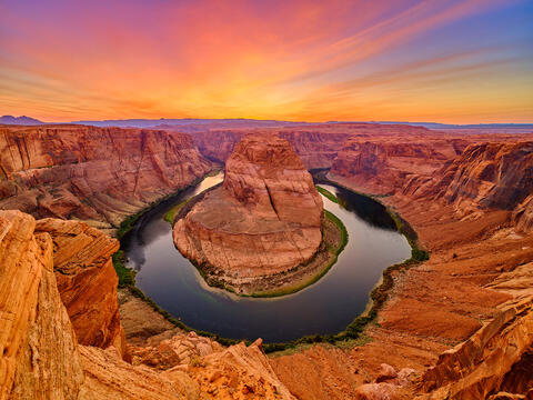 a dramatic photograph of Horseshoe Bend in Page, Arizona at sunset in the American Southwest.  Fine Art Limited Edition Photography by artist Andrew Shoemaker