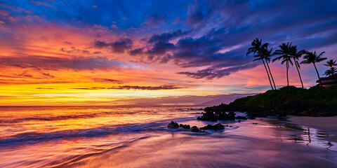 a very vibrant sunset panoramic photograph at Polo Beach in Wailea on the island of Maui.  Maui Landscape Photography by Andrew Shoemaker 