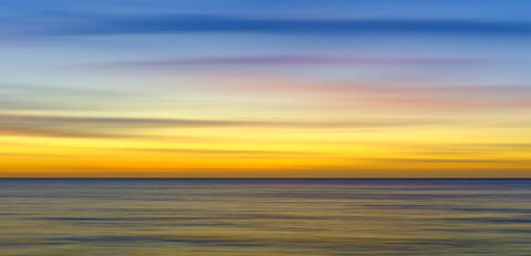 Zenfinity is a peaceful abstract ocean sunset image over the Pacific Ocean in Maui created by intentional camera movement.  Photograph by Andrew Shoemaker