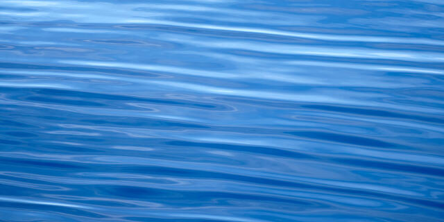 an abstract blue panoramic image of the beautiful pacific ocean photographed off the coast of Maui, Hawaii.  Abstract photography by Andrew Shoemaker