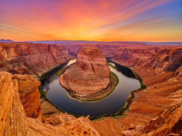 a dramatic photograph of Horseshoe Bend in Page, Arizona at sunset in the American Southwest.  Fine Art Limited Edition Photography by artist Andrew Shoemaker