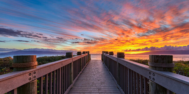 bridge looking out to sunset behind Duke's along the world famous Ka'anapali Beach in Lahaina, Hawaii on the island of Maui