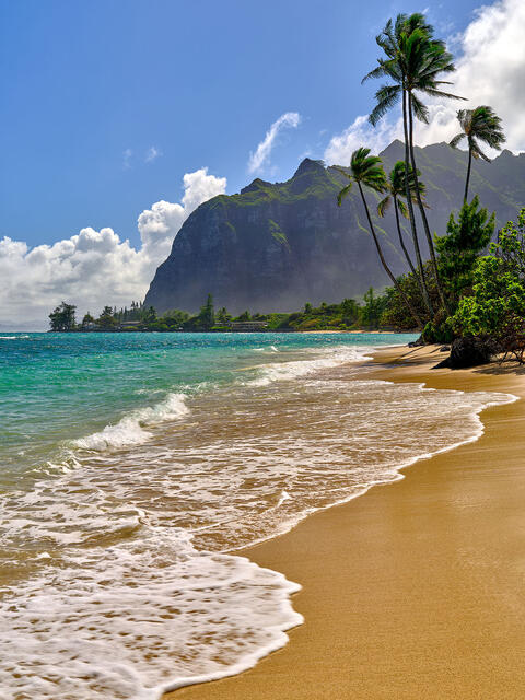 a beach scene along the windward coast of Oahu featuring Ka'awa Beach and the Ko'olau mountain range.  Fine Art Hawaii Landscape Photography by Andrew Shoemaker