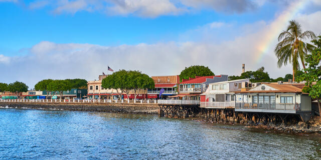 a panoramic image of the historic and iconic Front Street on the island of Maui, Hawaii featuring a rainbow.