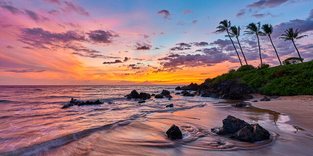 a panoramic sunset with lovely pastel colors and water movement from the ocean at Polo Beach on the island of Maui.  Fine art photograph by Andrew Shoemaker