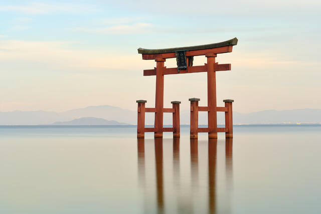 Longevity is a long exposure of the beautiful red Torii Shirahige shrine on Lake Biwa in Japan.  Fine Art Photography by artist Andrew Shoemaker 