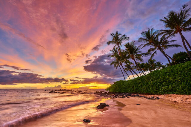 Another classic south Maui sunset at White Rock (Palauea) in Wailea highlighted by vibrant pink and purple colors