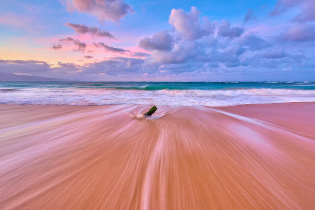 a photograph of a north shore Maui beach scene at Baldwin in Paia with the outgoing waves and pastel colors at sunrise.  Hawaii photography by Andrew Shoemaker