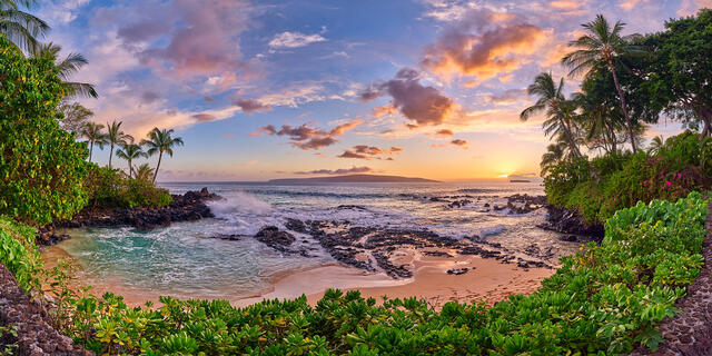panorama of the beautiful Secret Beach in Makena on the island of Maui at sunset