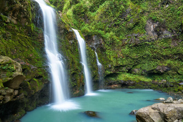 a waterfall photograph of three bears also known as upper waikani falls along the road to Hana on the Hawaiian island of Maui.  Photography by Andrew Shoemaker