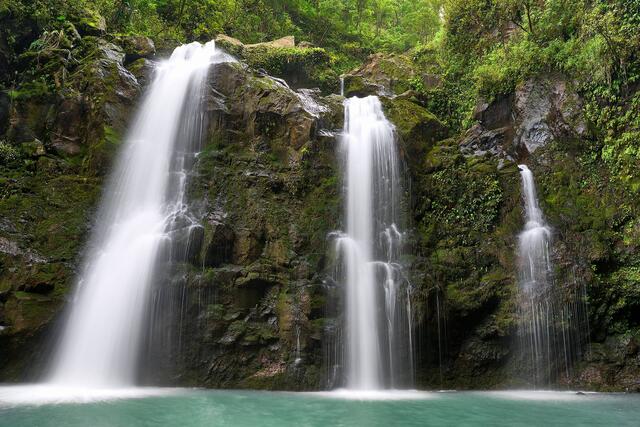 a long exposure photograph of the beautiful upper Waikani waterfall located along the road to Hana.  Maui waterfall photography by Andrew Shoemaker