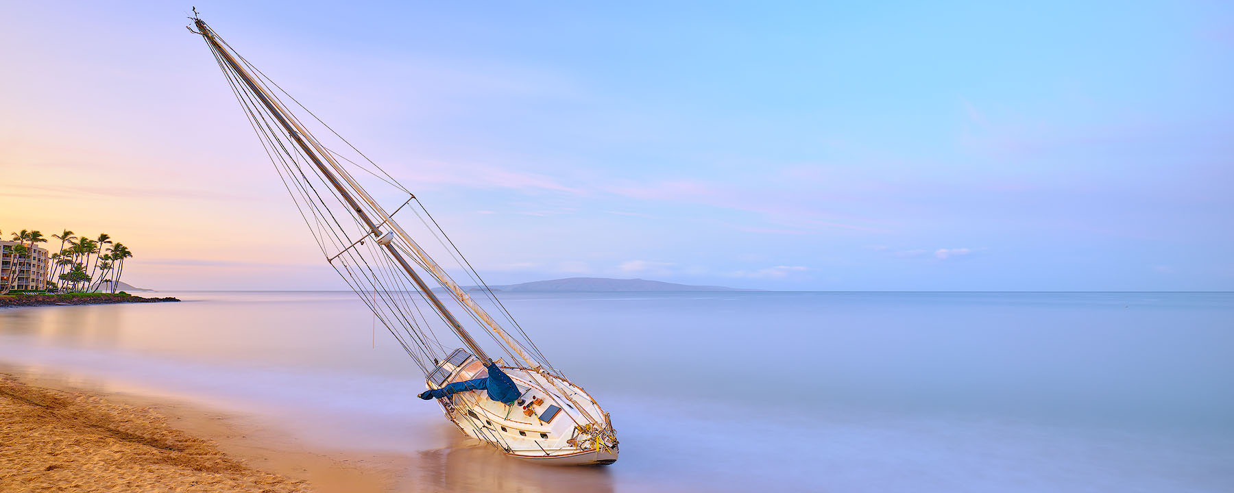 Hawaii panoramic image of a shipwreck that washed up on kamaole one beach in Kihei, Hawaii after a recent storm.  Panorama Photography by Andrew Shoemaker