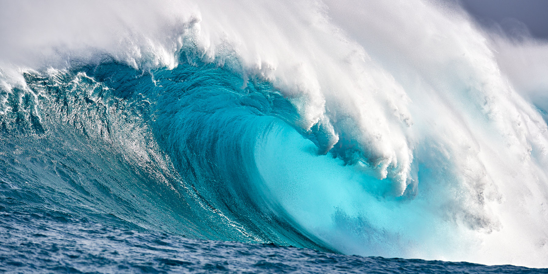 Blue Crush panoramic image of the biggest wave in Hawaii, Jaws located on the island of Maui reaches heights up to seventy feet. Hawaii big wave photography