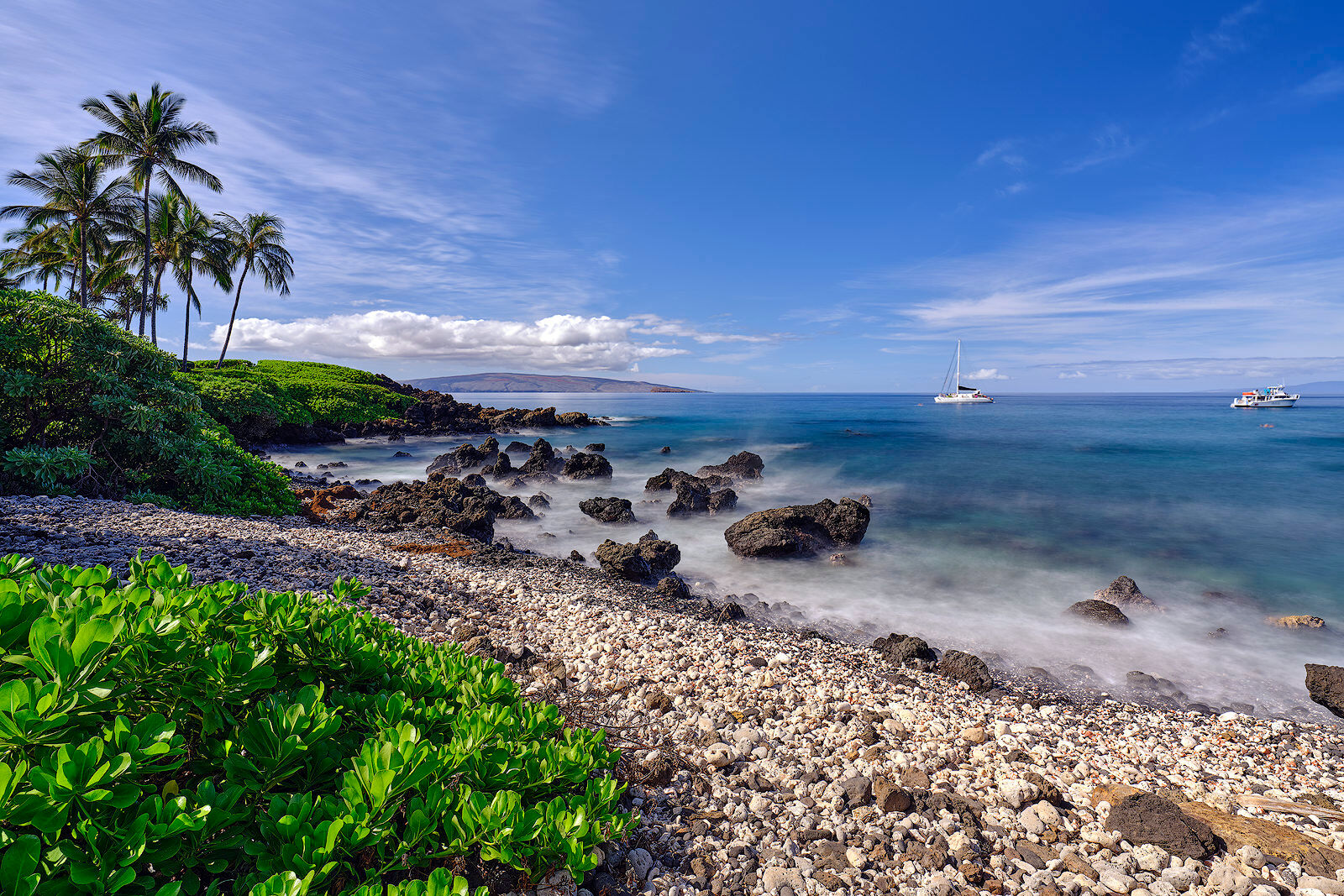 a daytime scene of a white coral beach in south maui.  Photographed by Andrew Shoemaker