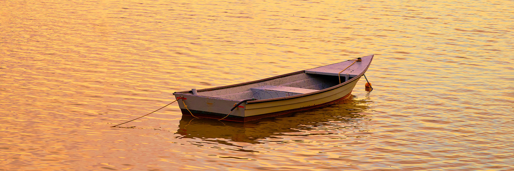 Cruisin' panoramic photo of a lone row boat along the windward side of the Hawaiian island of Oahu. Hawaii Panorama Photography by artist Andrew Shoemaker
