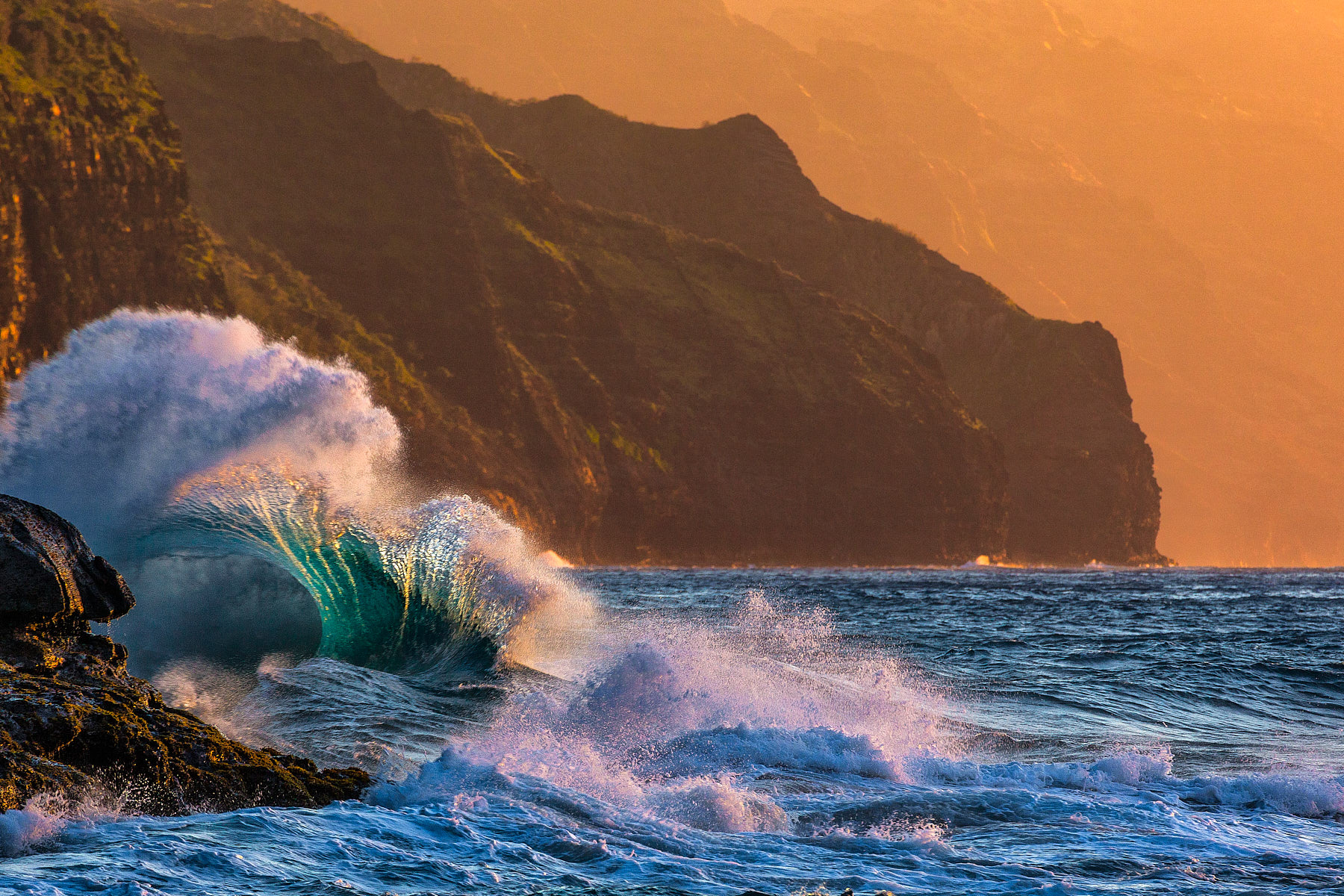 Depth Charge Waves collide along the Na Pali Coastline at Ke'e Beach at sunset and make some very interesting patterns
