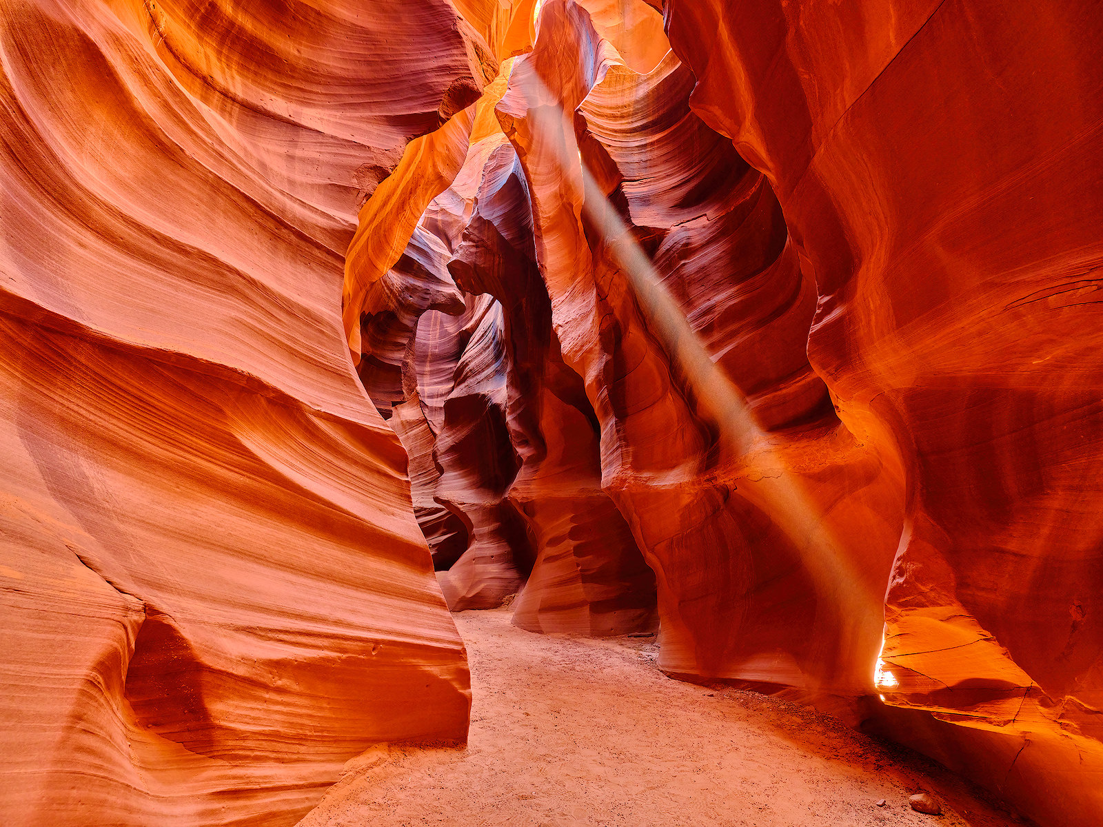 photograph inside of upper antelope canyon in page, arizona featuring a beam of light from the sky.  Fine Art Arizona photography from artist Andrew Shoemaker