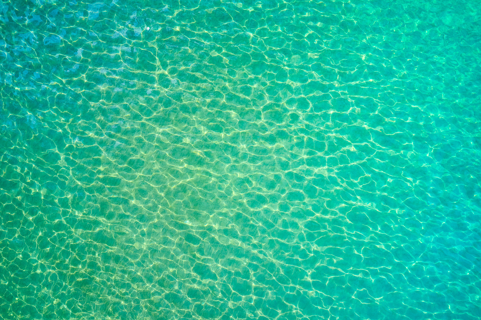 Electric Emerald An aerial scene of amazing emerald Maui water color from the sky. This unique abstract was captured by Andrew Shoemaker