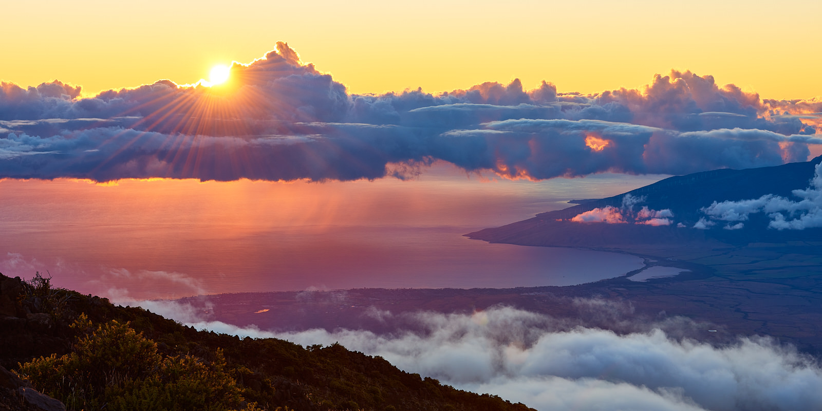 the view looking down on the western slope of Maui from on top of Haleakala Summit at Haleakala National Park on the island of Maui