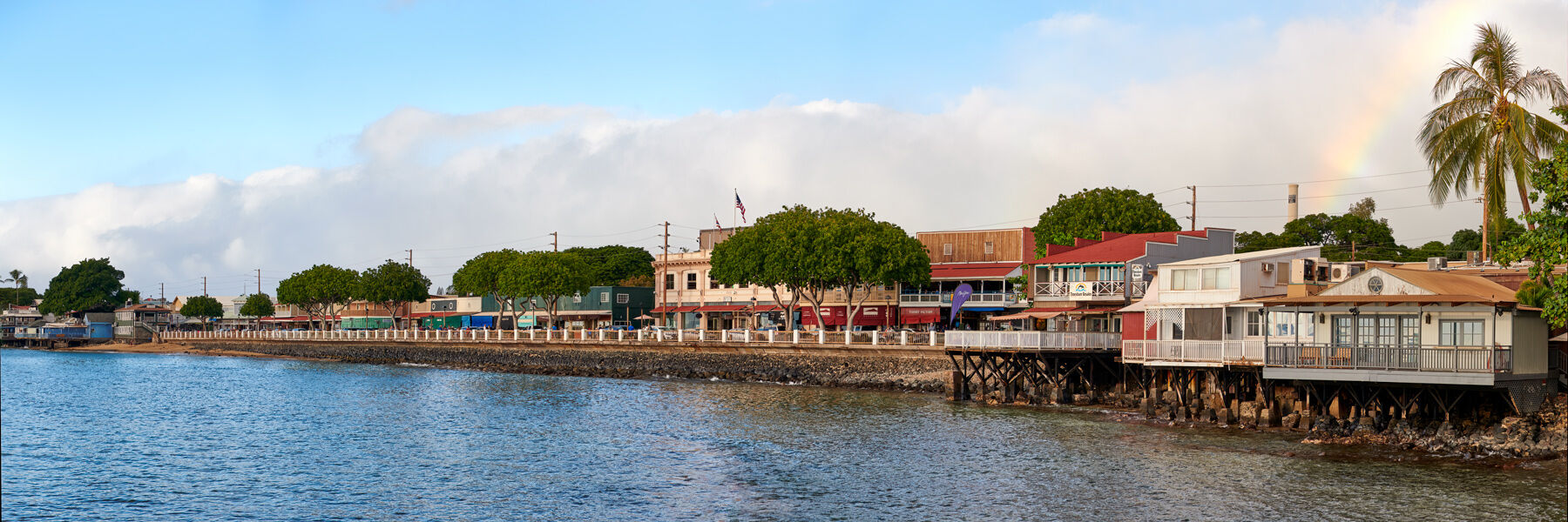 Front Street a beautiful panorama of the famous Front Street in downtown Lahaina featuring a rainbow in the background. Front Street was tragically destroyed by a fire