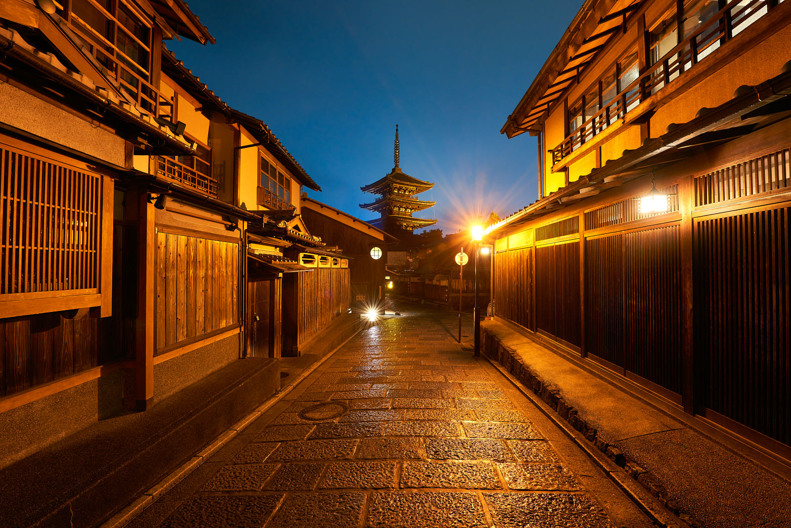 Higashiyama Street view in the well preserved Higashiyama district in Kyoto, Japan with a pagoda in the background at night