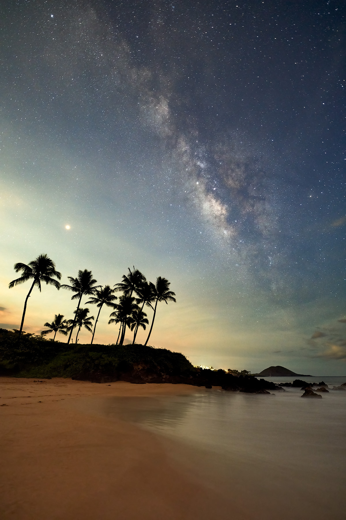 a night time image of the milky way galaxy over the beautiful beach in Makena on the island of Maui, Hawaii.  Fine art nature photography by Andrew Shoemaker
