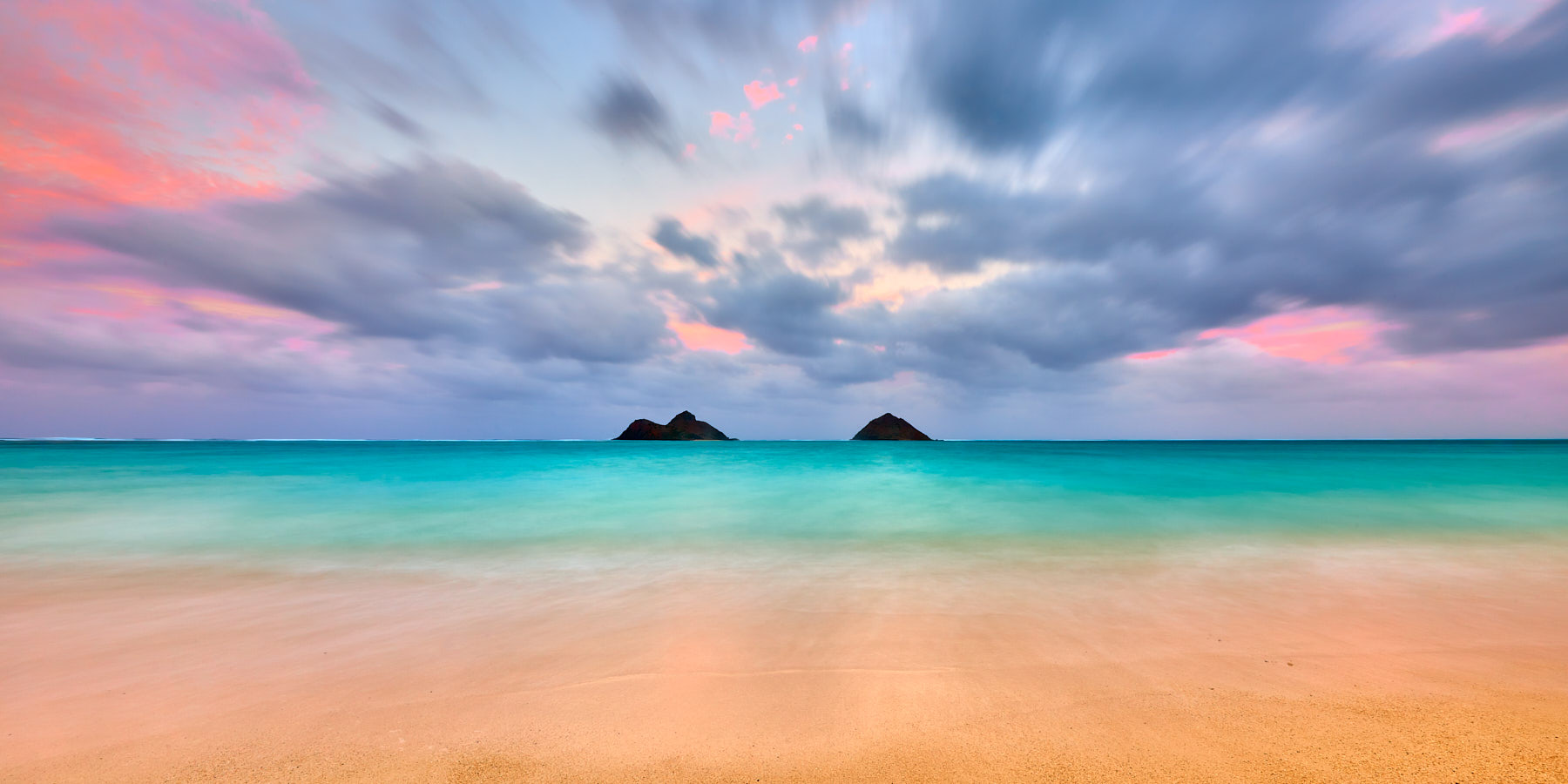 A long exposure panoramic photograph captured at the beautiful Lanikai Beach on the island of Oahu.  Pastel colors at sunset here make this photograph special