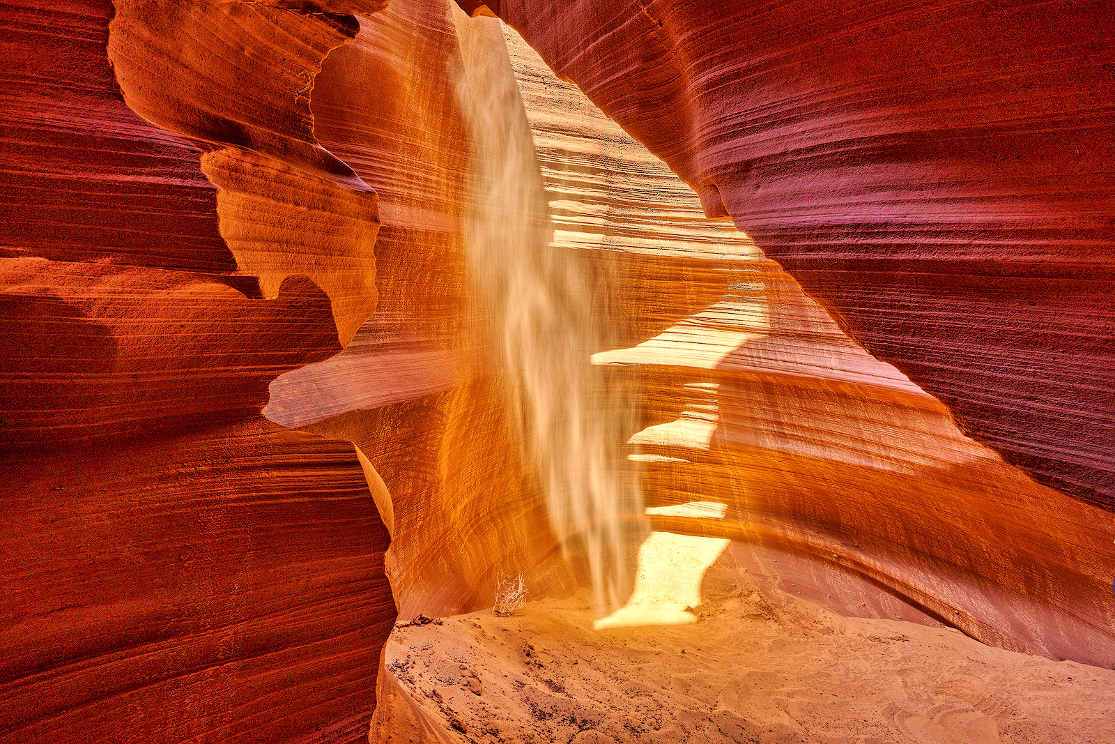 sandstone formations inside of rattle snake canyon and the sunlight creates the look of a face in the rock.  American Southwest Photography by Andrew Shoemaker