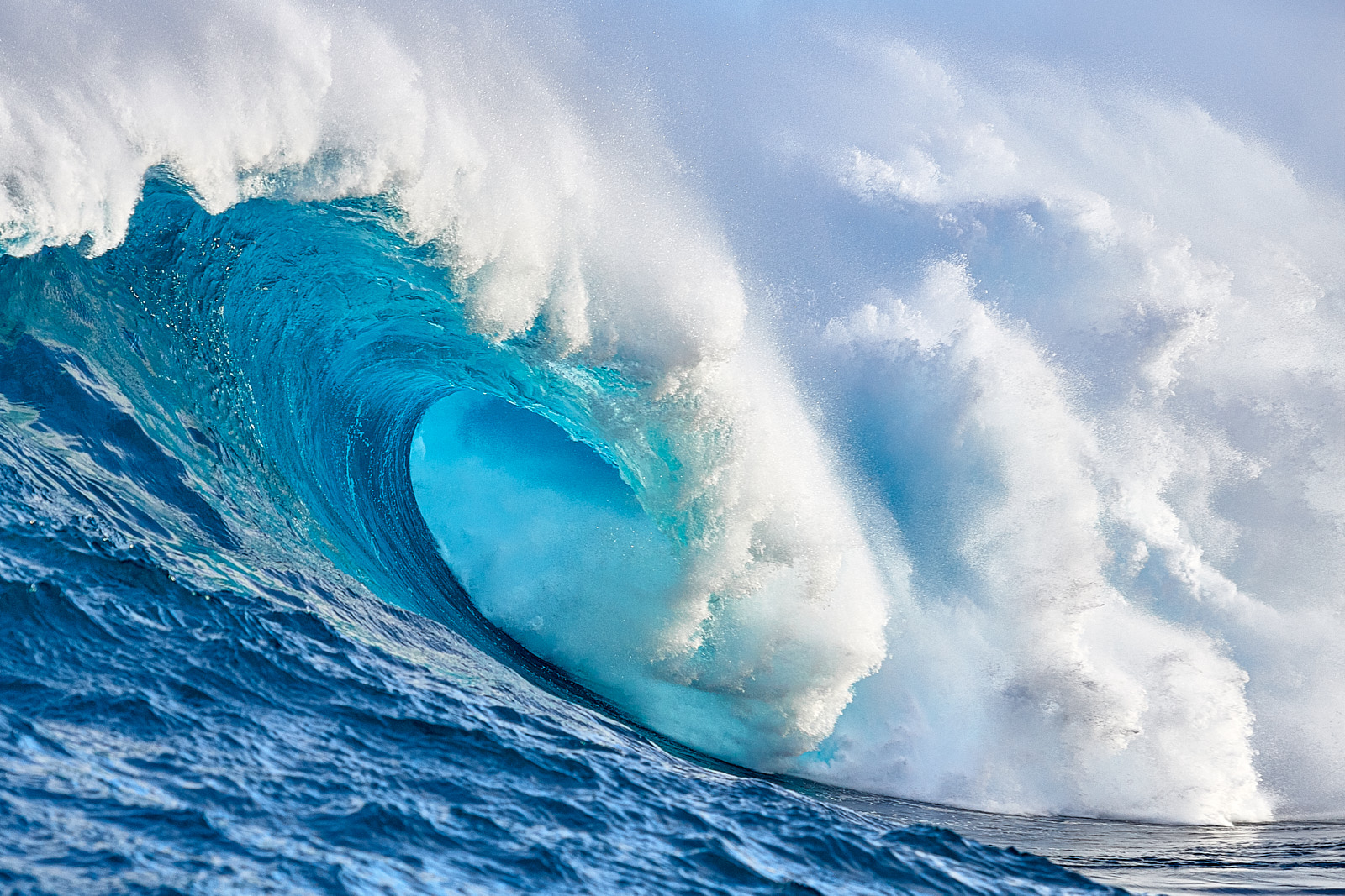 aqua blue water right down the barrel at the largest wave in the Hawaiian islands Jaws or Peahi on the island of Maui