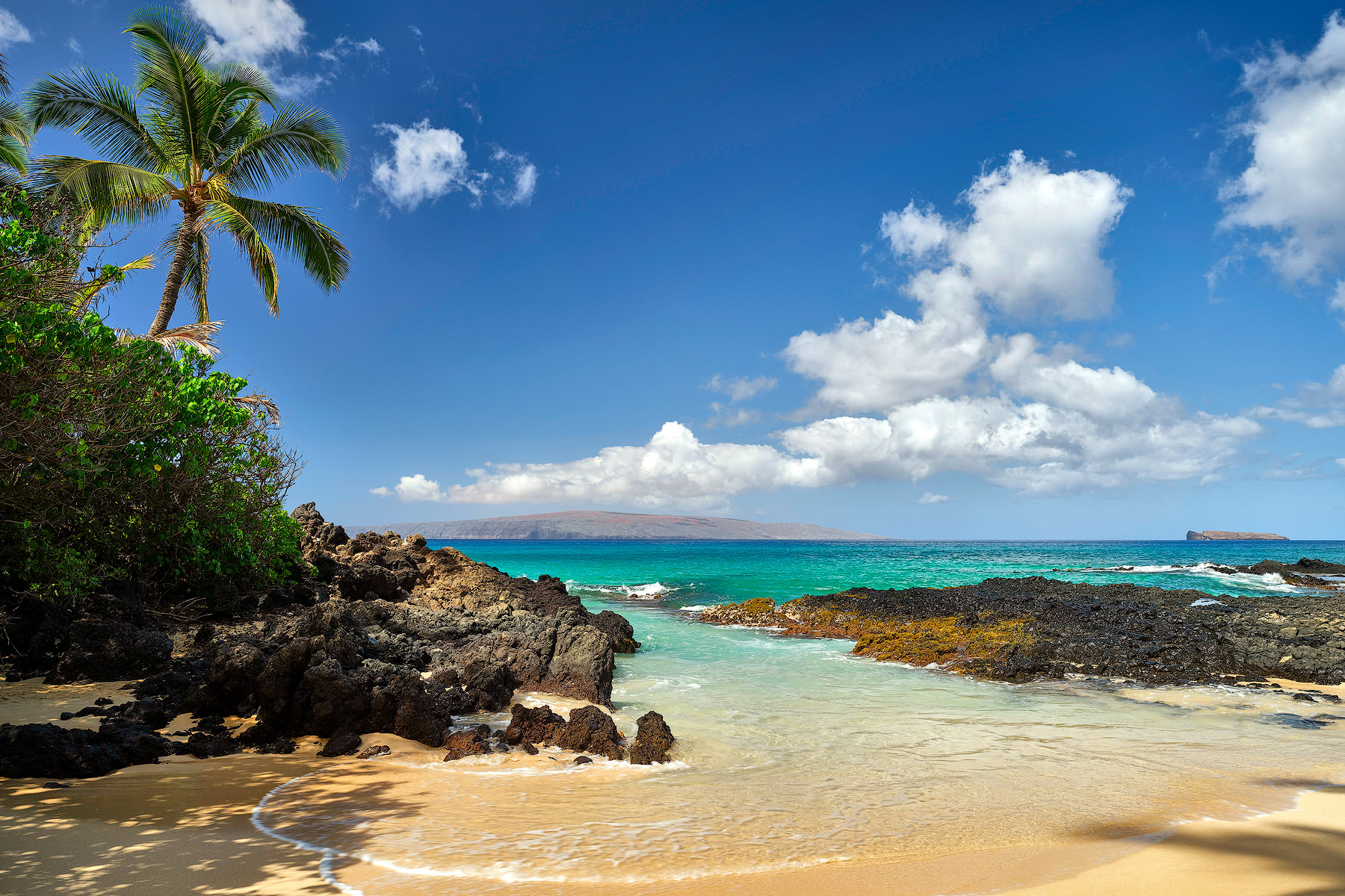 a daytime photograph of Secret Beach (also known as Makena Cove) on the island of Maui.  Hawaii Fine Art Landscape photography by photographer Andrew Shoemaker