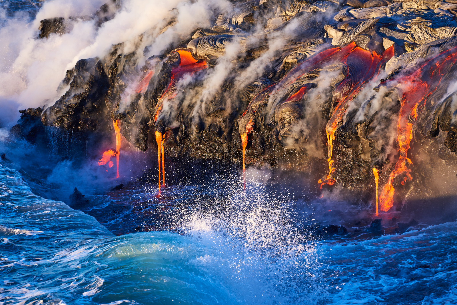 Opposing Forces lava ocean entry photography at sunrise on the Big Island of Hawaii in Volcanoes National Park