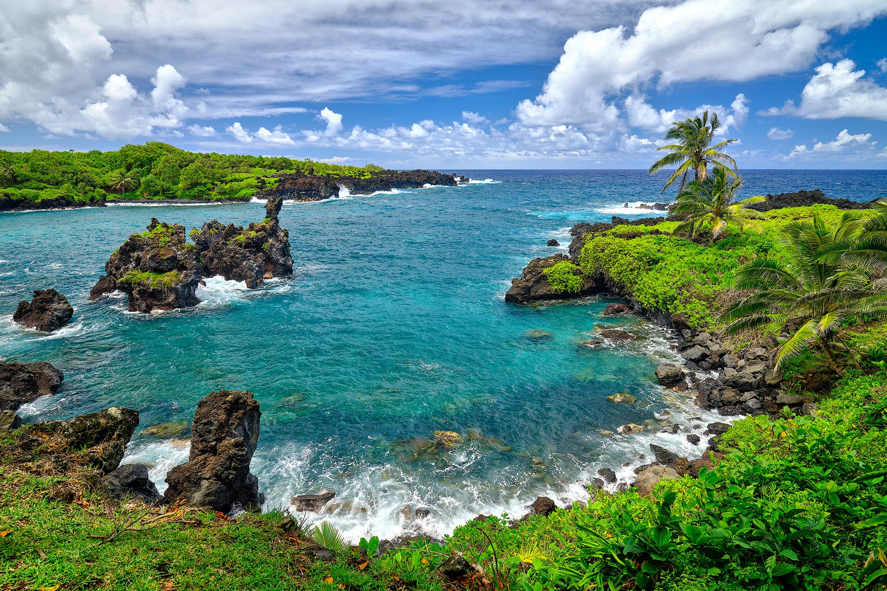 a photograph featuring the beautiful turquoise waters of Waianapanapa state park on the Hawaiian island of Maui.  Hawaii Nature Photography by Andrew Shoemaker