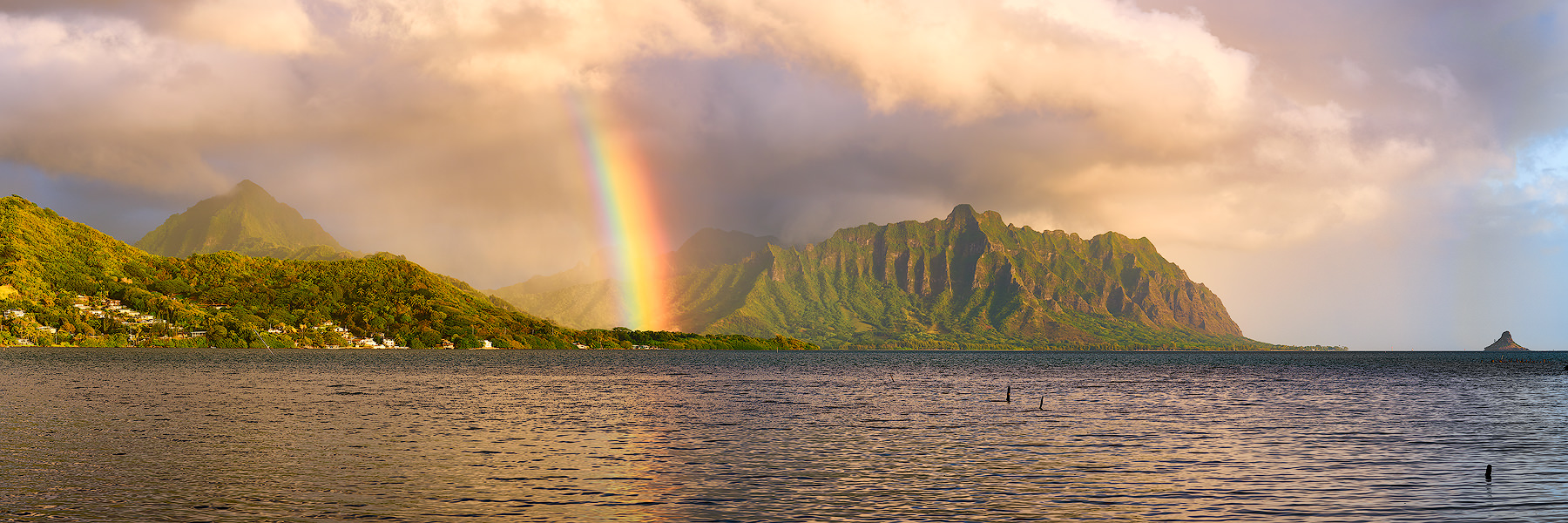 Windward Glory a beautiful panoramic photograph of the koolau mountain range with a rainbow at sunrise on the island of Oahu, Hawaii. Landscape photo by Andrew Shoemaker